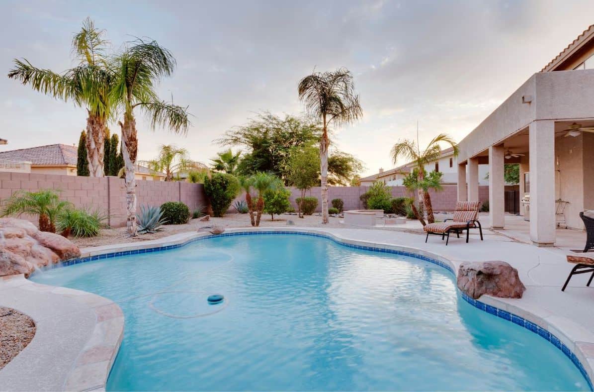 Cool blue backyard pool in the sunshine