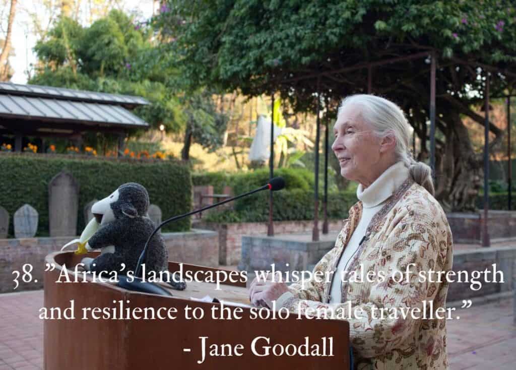 Jane Goodall standing at a podium making a speech