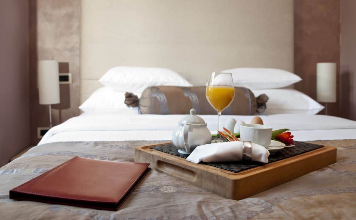 Lovely hotel bed with breakfast tray