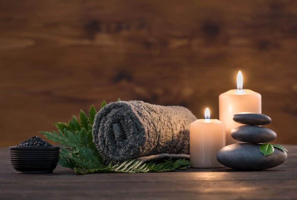Spa photo with candles and greenery