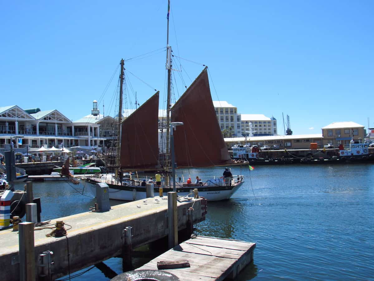 A sailboat in V&A Waterfront's harbour