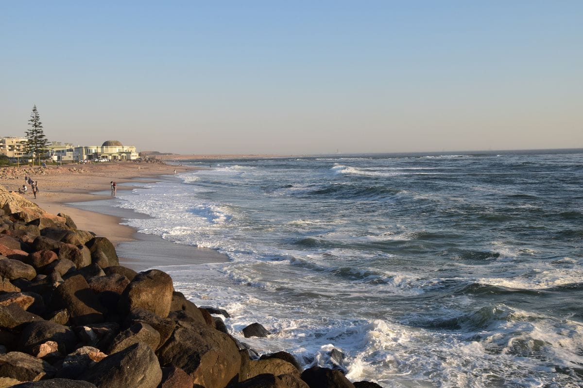Swakopmund beach in Namibia, from the rocks across the sand.